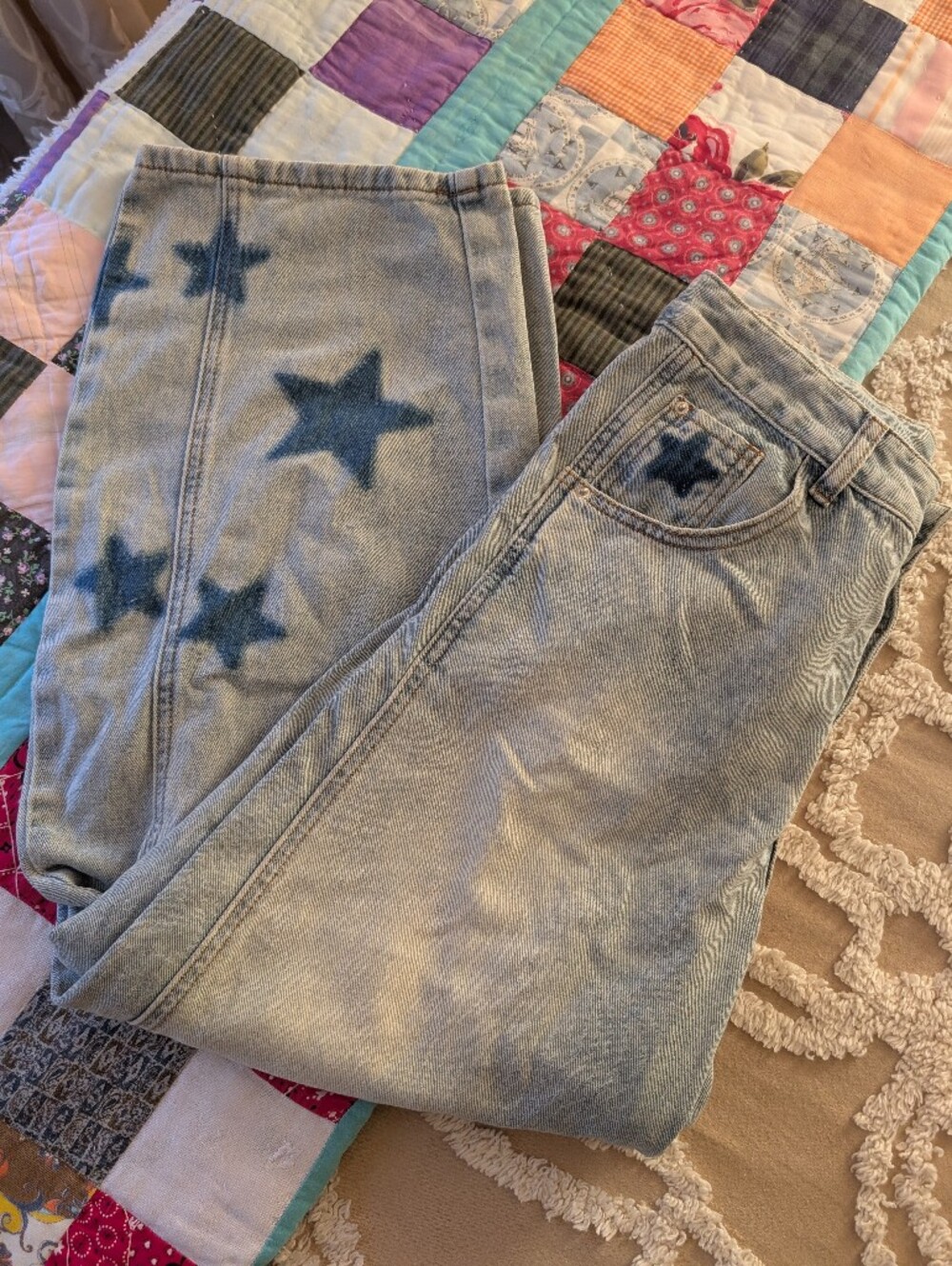 Star jeans, distressed light wash barrel style jeans